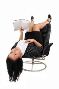1269293 girl lies in an armchair and reads 2